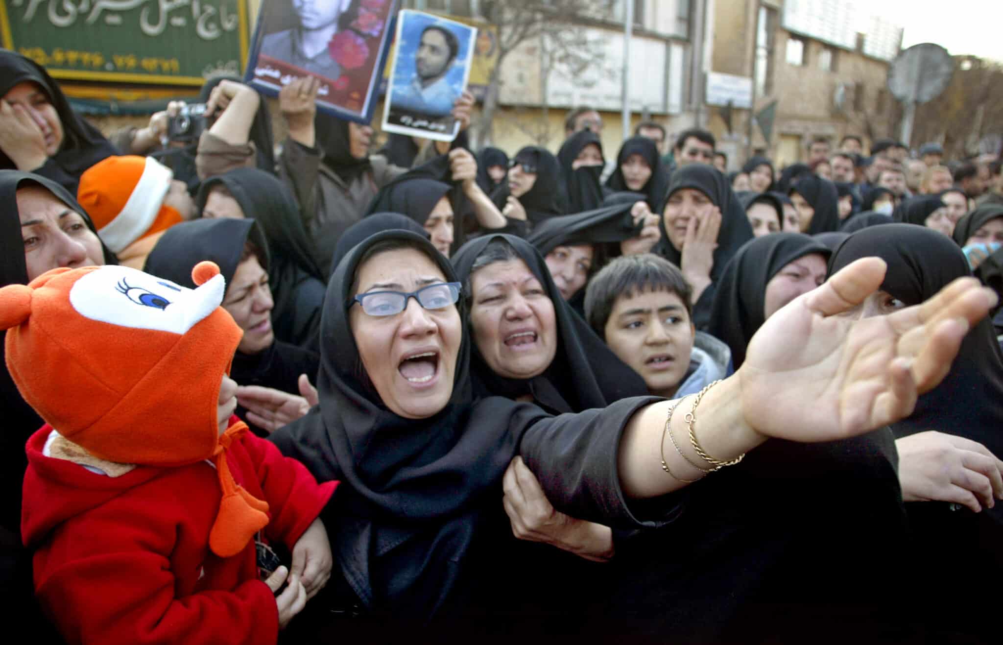 Iranian woman mourns as she attends funeral ceremony in Tehran